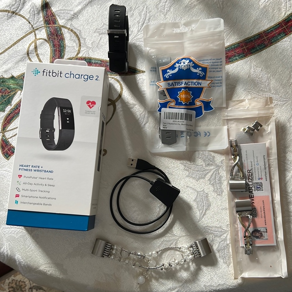 Fitbit charge 2 with several accessories